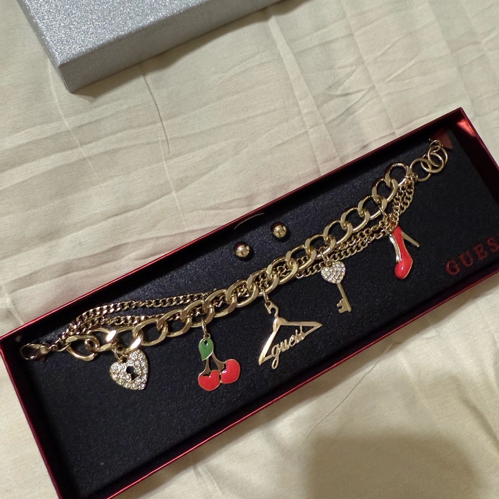 Guess Gold Charm Bracelet with Red Accents